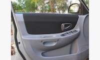 Набор вставок в двери из кожзаменителя (Винилискожа) Hyundai Accent, черные перфорированные