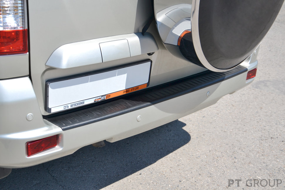 Накладка на задний бампер УАЗ Патриот 2014- (черное тиснение, ABS)